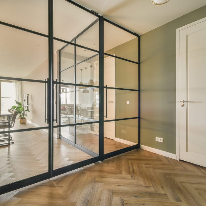 Dining area behind glass doors in a modern cozy house